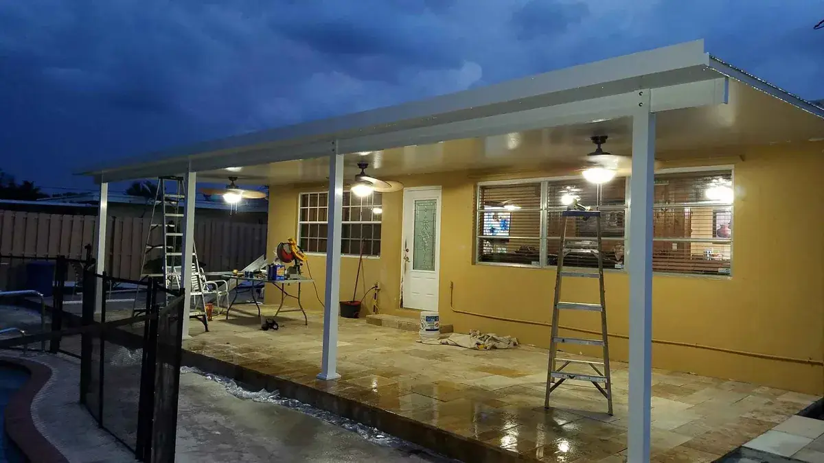 Completed covered patio renovation at dusk